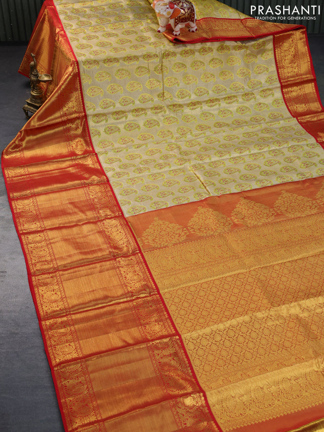 Pure kanchipuram tissue silk saree gold and red with allover zari woven brocade weaves and long zari woven border