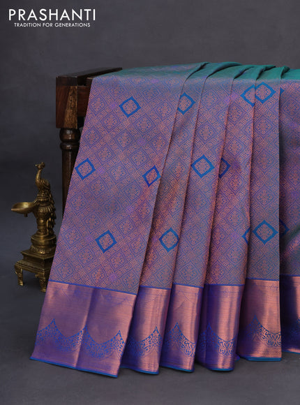 Pure kanchipuram silk saree dual shade of peacock blue with allover zari woven brocade weaves and copper zari woven border