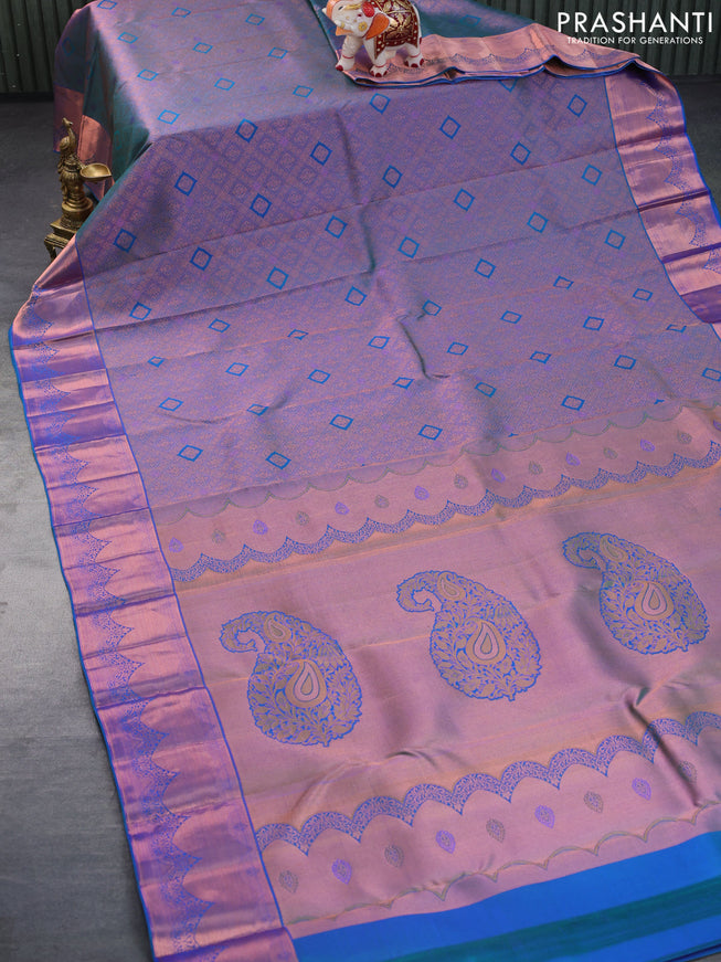 Pure kanchipuram silk saree dual shade of peacock blue with allover zari woven brocade weaves and copper zari woven border