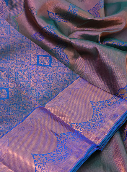 Pure kanchipuram silk saree dual shade of peacock blue with allover zari woven brocade weaves and copper zari woven border