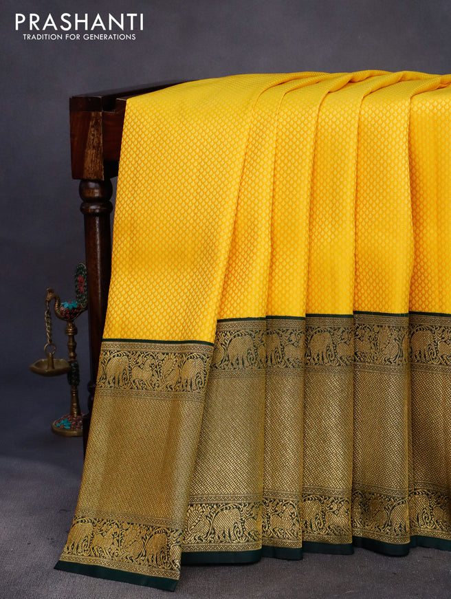 Pure kanchipuram silk saree yellow and green with allover self emboss and long zari woven border