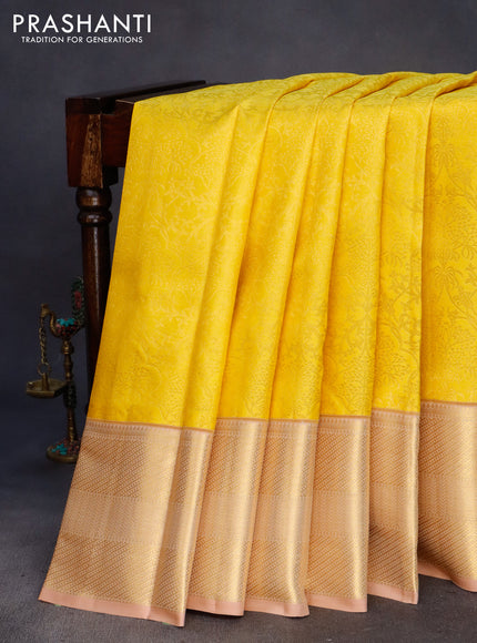 Pure kanchipuram silk saree yellow and sandal with allover zari woven brocade weaves and zari woven border