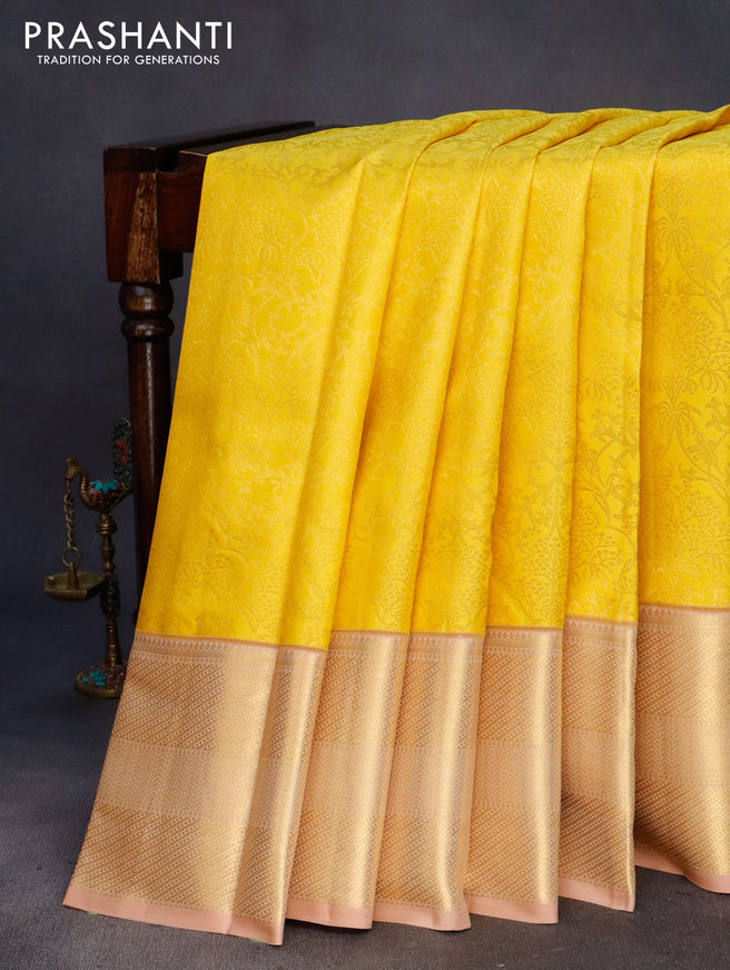 Pure kanchipuram silk saree yellow and sandal with allover zari woven brocade weaves and zari woven border