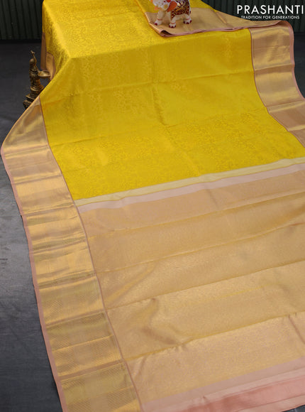 Pure kanchipuram silk saree yellow and sandal with allover zari woven brocade weaves and zari woven border