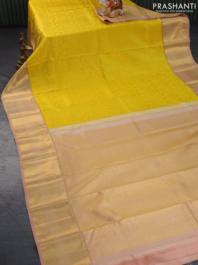 Pure kanchipuram silk saree yellow and sandal with allover zari woven brocade weaves and zari woven border