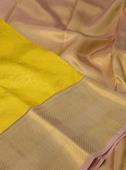 Pure kanchipuram silk saree yellow and sandal with allover zari woven brocade weaves and zari woven border