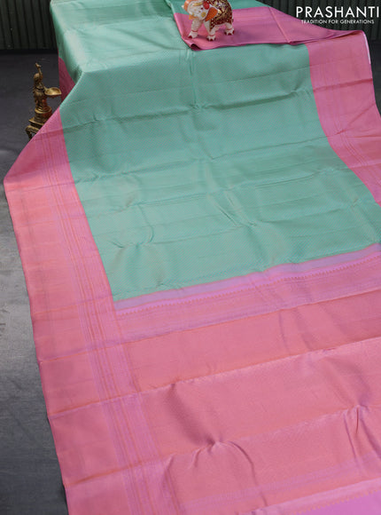 Pure kanchipuram silk saree teal blue and light pink with allover zari woven brocade weaves and copper zari woven border