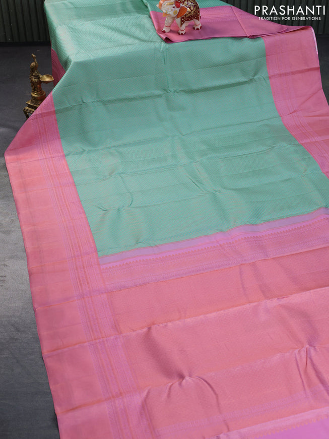 Pure kanchipuram silk saree teal blue and light pink with allover zari woven brocade weaves and copper zari woven border