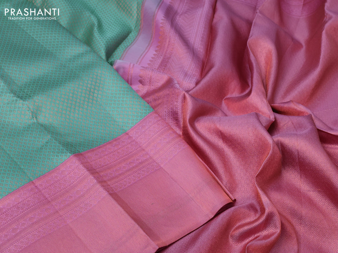 Pure kanchipuram silk saree teal blue and light pink with allover zari woven brocade weaves and copper zari woven border