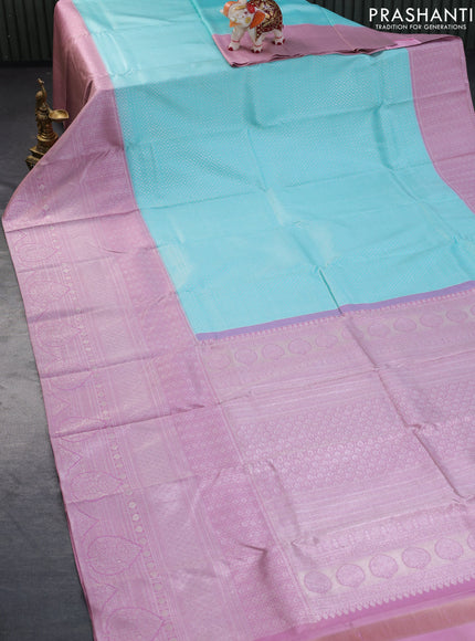 Pure kanchipuram silk saree light blue and pastel pink with allover silver zari woven brocade weaves and long silver zari woven border