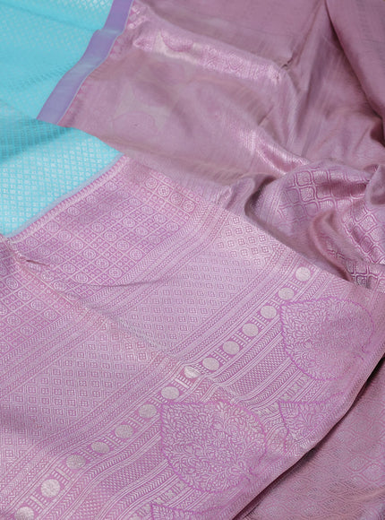 Pure kanchipuram silk saree light blue and pastel pink with allover silver zari woven brocade weaves and long silver zari woven border