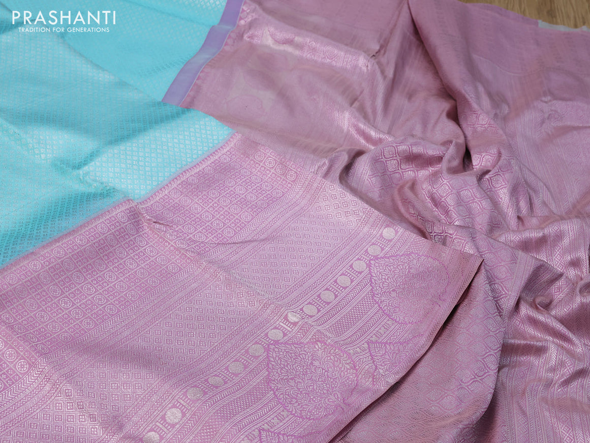 Pure kanchipuram silk saree light blue and pastel pink with allover silver zari woven brocade weaves and long silver zari woven border