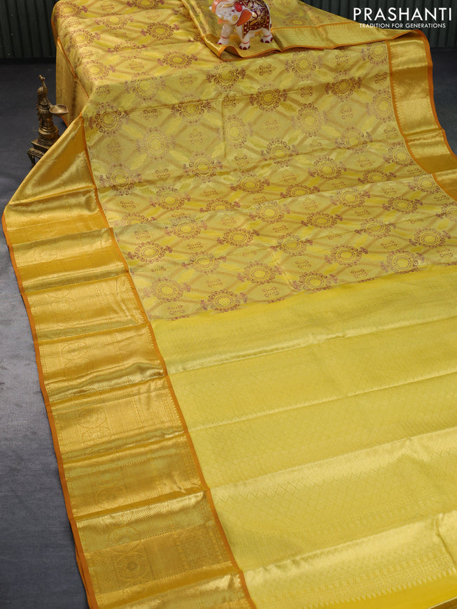 Pure kanchipuram tissue silk saree gold and sandal with allover zari woven brocade weaves and long zari woven border