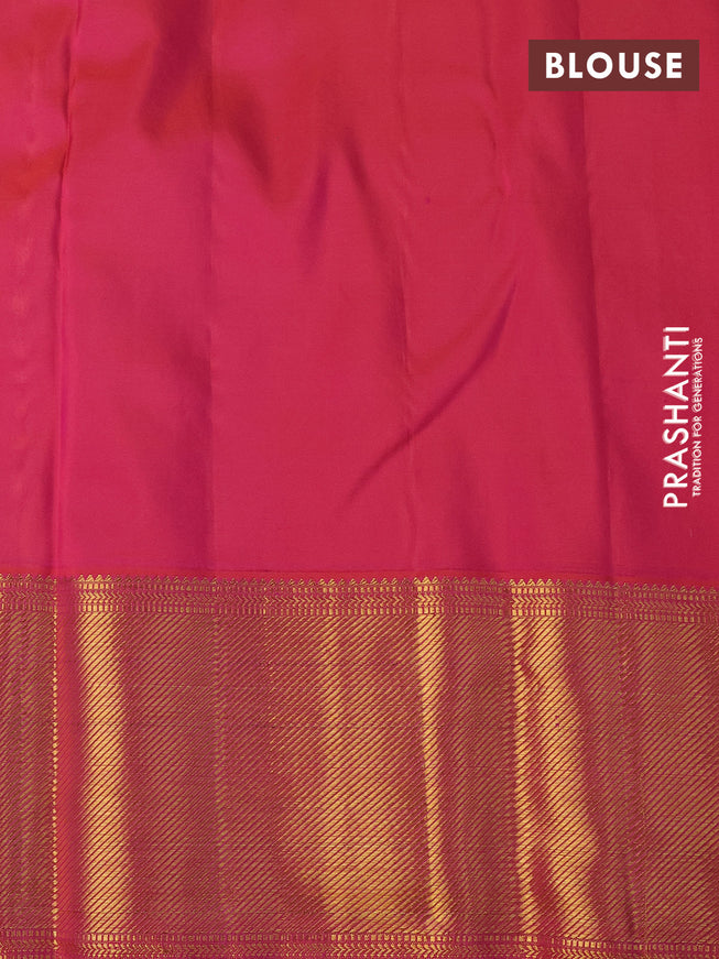 Pure kanchipuram silk saree sandal and dual shade of pinkish orange with allover zari woven butta weaves and long zari woven border