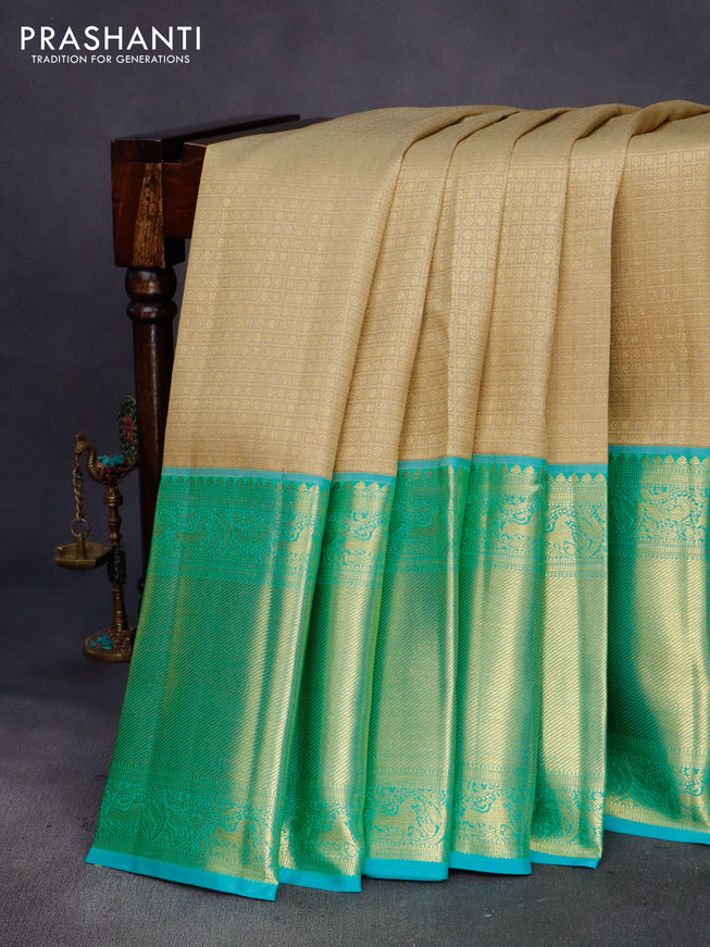 Pure kanchipuram silk saree sandal and teal blue with allover zari woven brocade weaves and long zari woven border