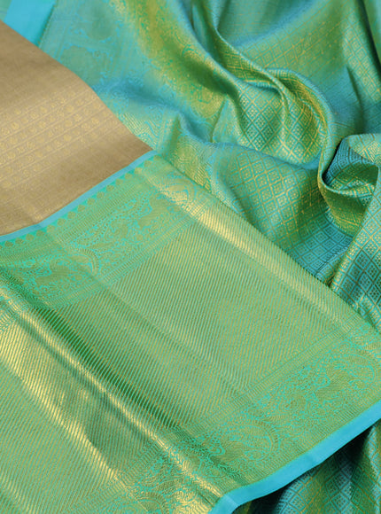 Pure kanchipuram silk saree sandal and teal blue with allover zari woven brocade weaves and long zari woven border