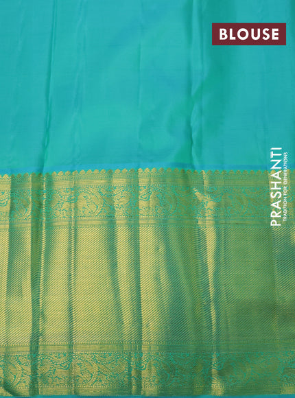 Pure kanchipuram silk saree sandal and teal blue with allover zari woven brocade weaves and long zari woven border