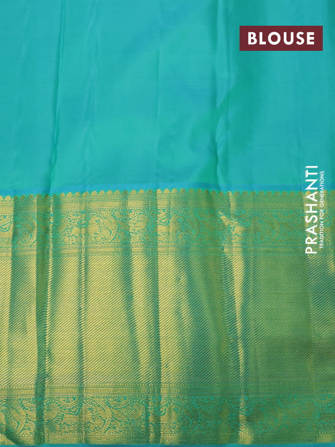 Pure kanchipuram silk saree sandal and teal blue with allover zari woven brocade weaves and long zari woven border