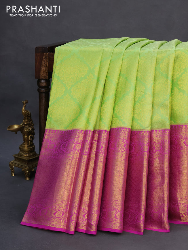 Pure kanchipuram silk saree light green and purple with allover zari woven brocade weaves and long zari woven border