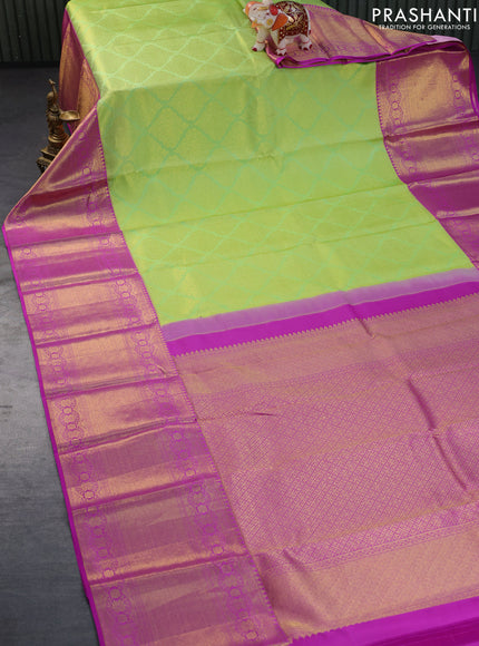 Pure kanchipuram silk saree light green and purple with allover zari woven brocade weaves and long zari woven border