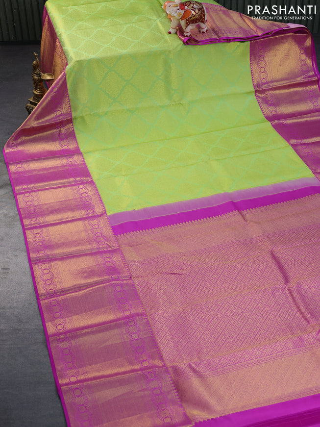 Pure kanchipuram silk saree light green and purple with allover zari woven brocade weaves and long zari woven border