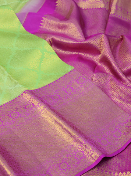 Pure kanchipuram silk saree light green and purple with allover zari woven brocade weaves and long zari woven border