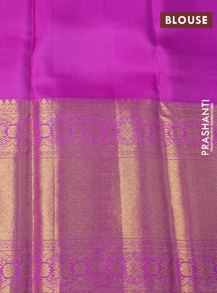 Pure kanchipuram silk saree light green and purple with allover zari woven brocade weaves and long zari woven border