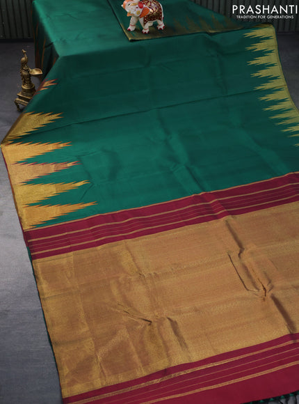 Pure kanchipuram silk saree green with plain body and temple design zari woven border