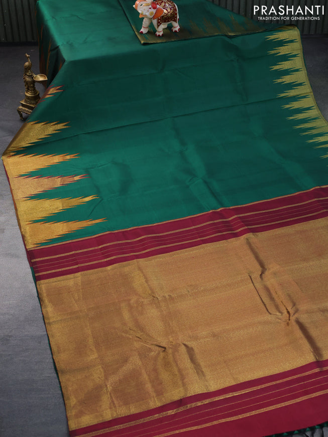 Pure kanchipuram silk saree green with plain body and temple design zari woven border