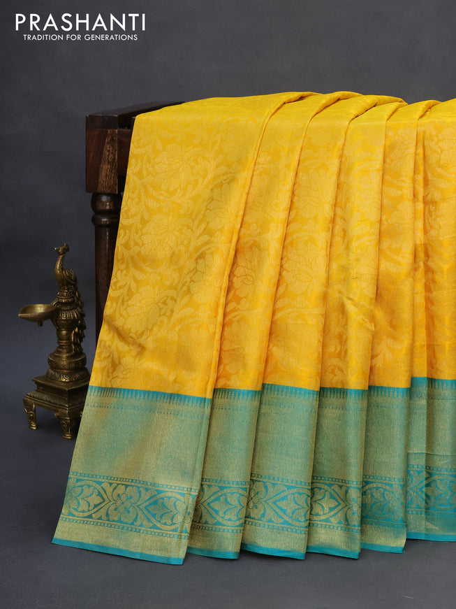 Pure kanchipuram silk saree yellow and teal blue with allover zari woven brocade weaves and zari woven border