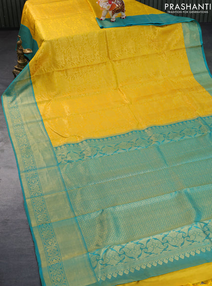 Pure kanchipuram silk saree yellow and teal blue with allover zari woven brocade weaves and zari woven border