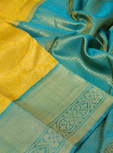 Pure kanchipuram silk saree yellow and teal blue with allover zari woven brocade weaves and zari woven border