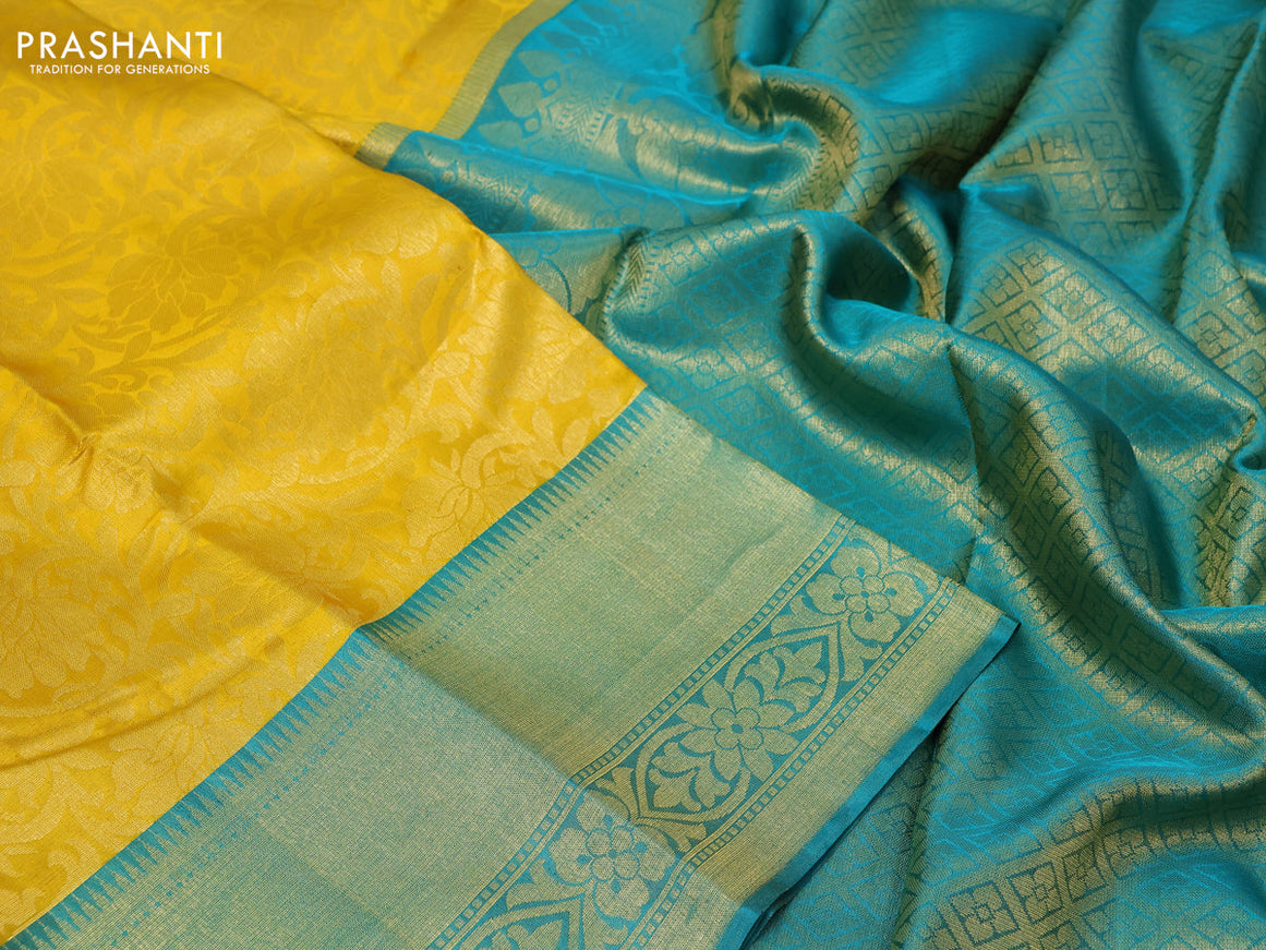 Pure kanchipuram silk saree yellow and teal blue with allover zari woven brocade weaves and zari woven border