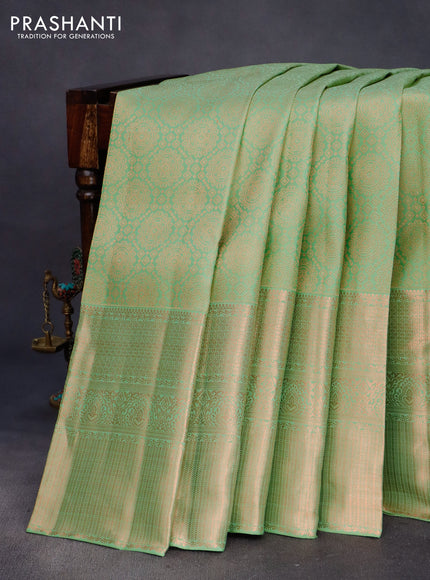 Pure kanchipuram silk saree pastel green with allover copper zari woven brocade weaves and long copper zari woven border