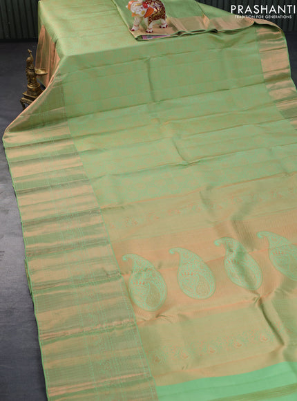 Pure kanchipuram silk saree pastel green with allover copper zari woven brocade weaves and long copper zari woven border