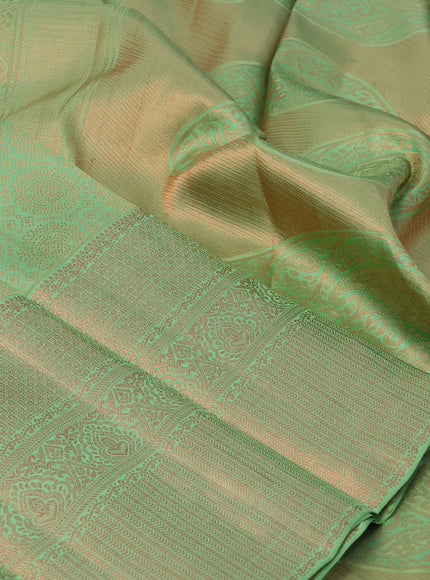 Pure kanchipuram silk saree pastel green with allover copper zari woven brocade weaves and long copper zari woven border