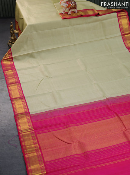 Pure kanchipuram silk saree sandal and pink with plain body and zari woven korvai border