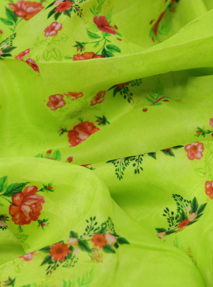 Organza silk saree lime green with allover floral prints and crocia lace border