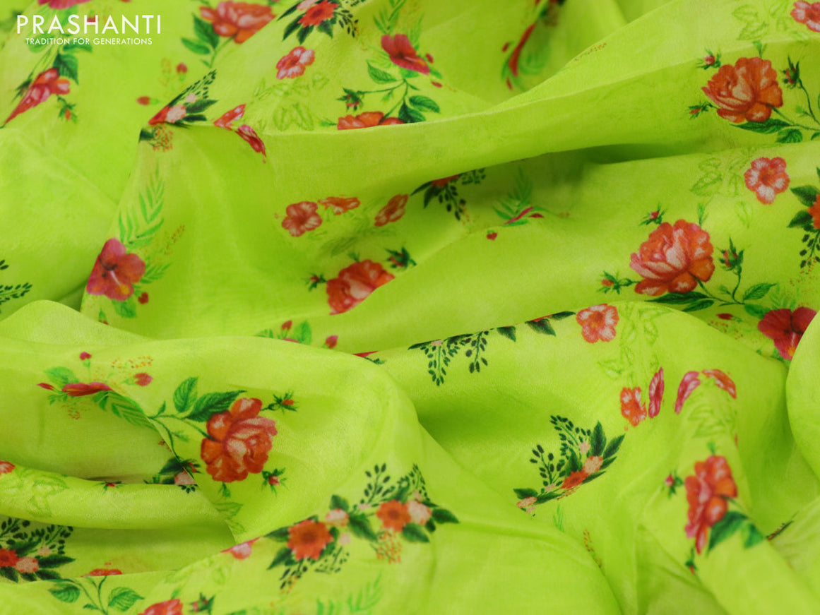 Organza silk saree lime green with allover floral prints and crocia lace border