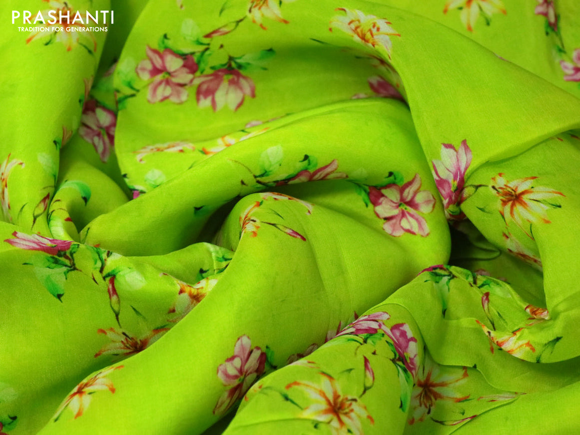 Organza silk saree fluorescent green with allover floral prints and crocia lace border