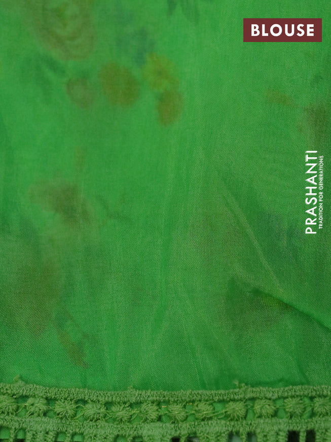 Organza silk saree green with allover floral prints and crocia lace border