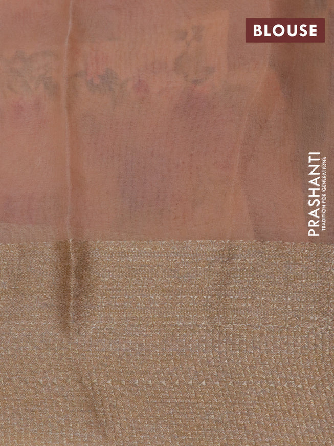 Organza silk saree peach orange with allover floral prints and woven border