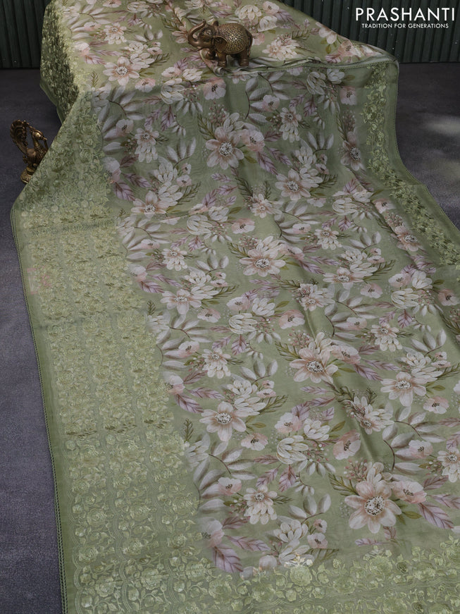 Pure organza silk saree green shade with allover floarl prints and long embroidery work border