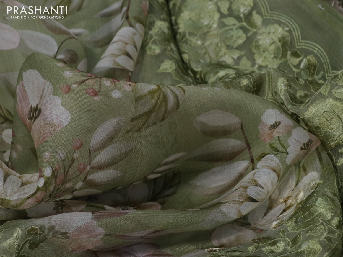 Pure organza silk saree green shade with allover floarl prints and long embroidery work border