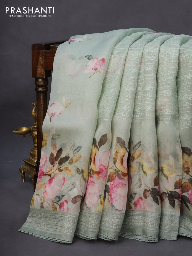 Pure organza partly silk saree pastel green with embroidery work buttas and floral printed embroidery work border