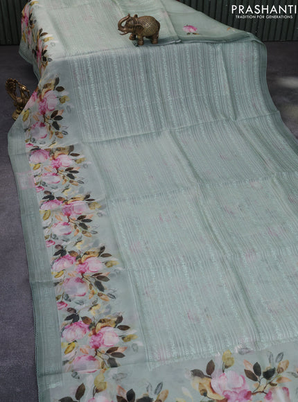 Pure organza partly silk saree pastel green with embroidery work buttas and floral printed embroidery work border