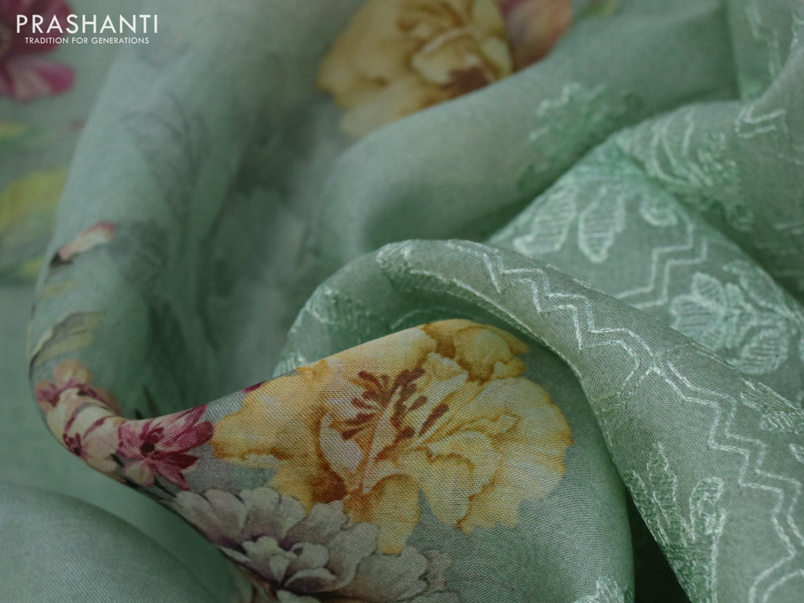 Pure organza silk saree pastel green with allover floral prints and long embroidery work & crocia lace border