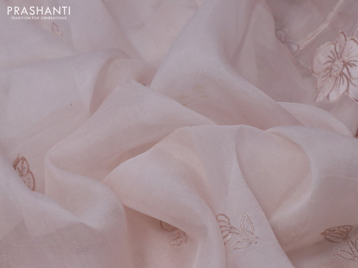 Pure organza silk saree pastel peach shade with embroidery work buttas and embroidery work border