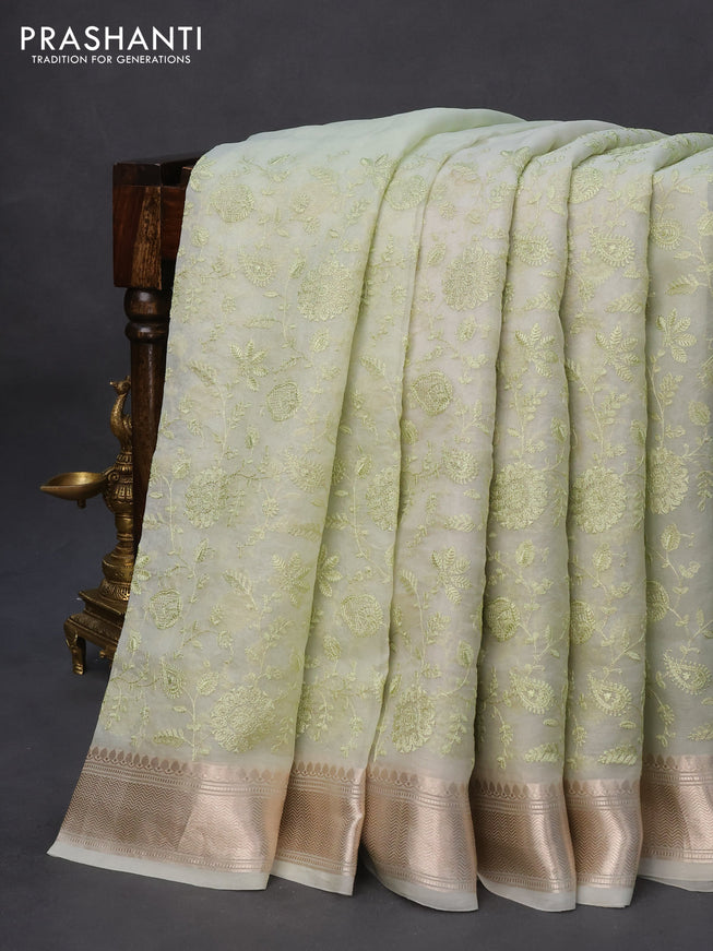 Pure organza silk saree pista green with allover embroidery work weaves and zari woven border