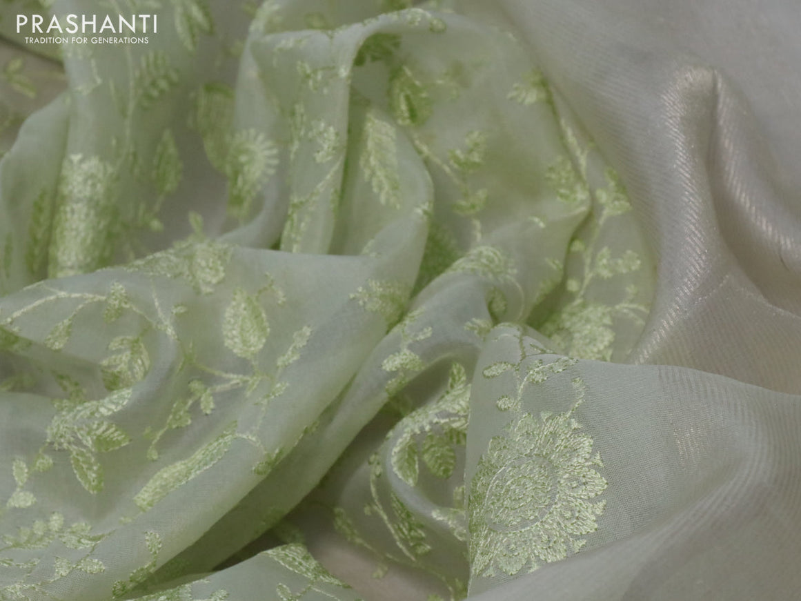 Pure organza silk saree pista green with allover embroidery work weaves and zari woven border